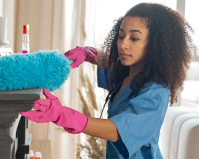 a caregiver cleaning the house